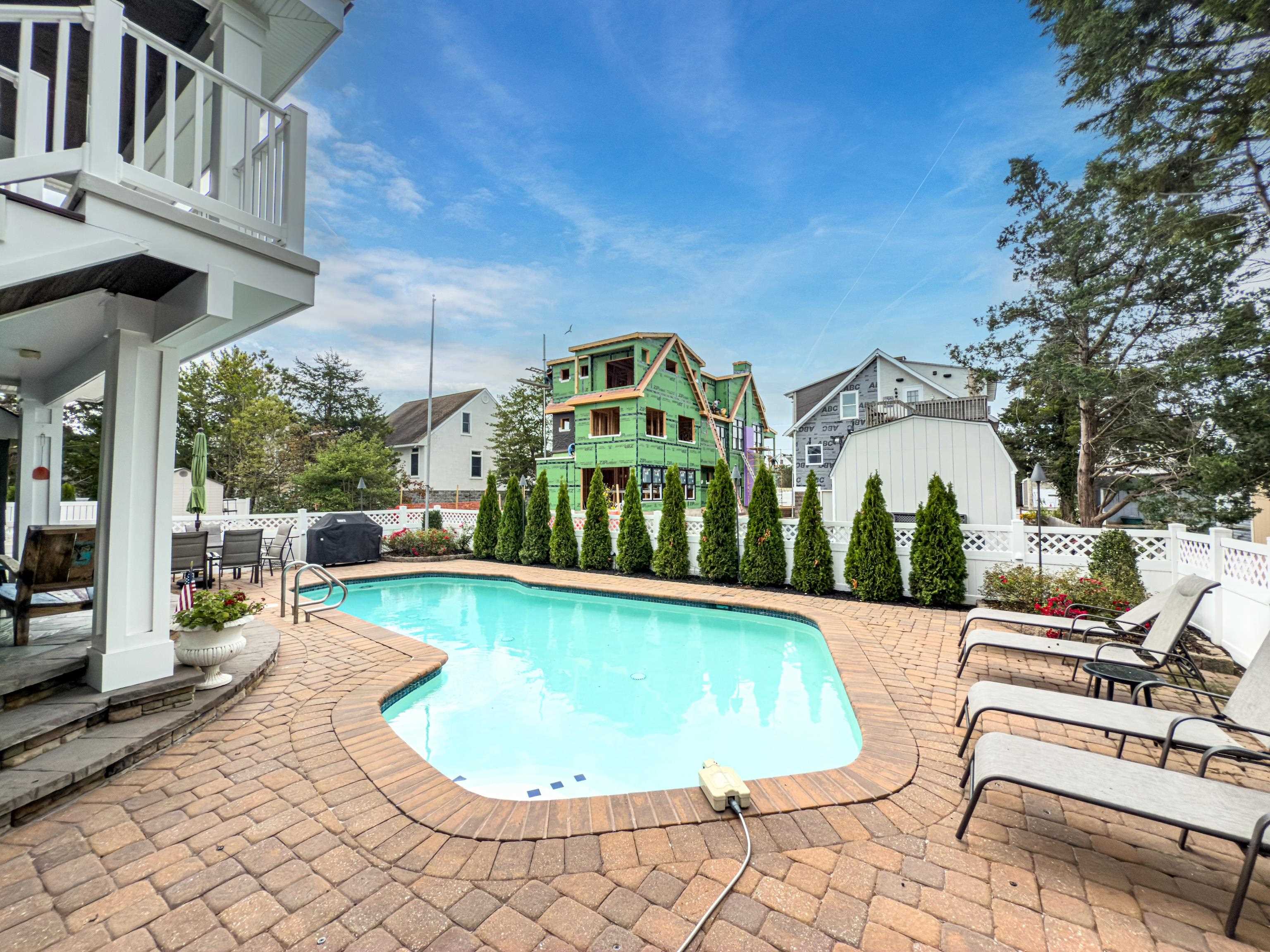 178 37th Street Avalon, NJ 08202 - Photo 25 of 26 a view of a swimming pool with sitting area