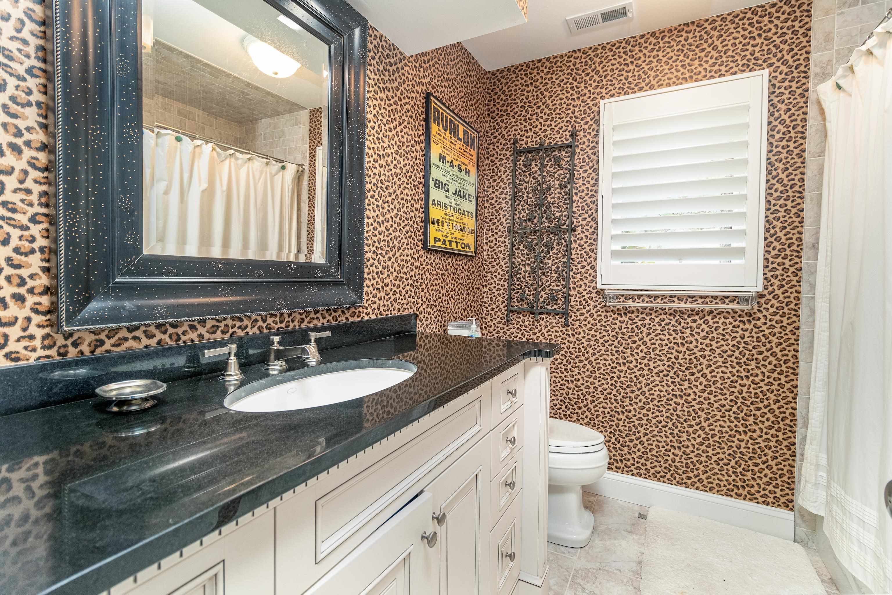 178 37th Street Avalon, NJ 08202 - Photo 7 of 26 a bathroom with a granite countertop sink mirror vanity and a toilet
