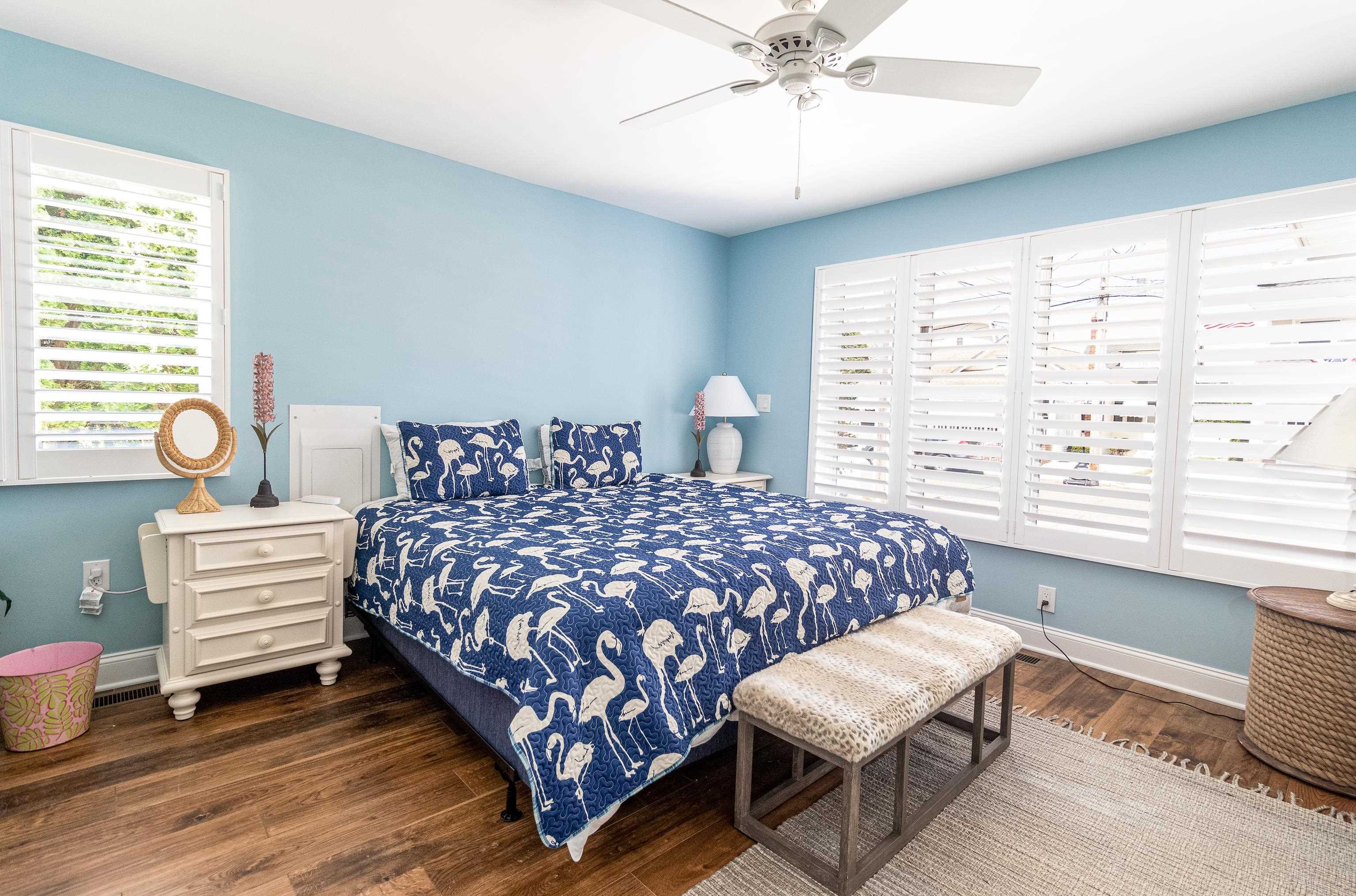 178 37th Street Avalon, NJ 08202 - Photo 8 of 26 a bedroom with a bed and windows