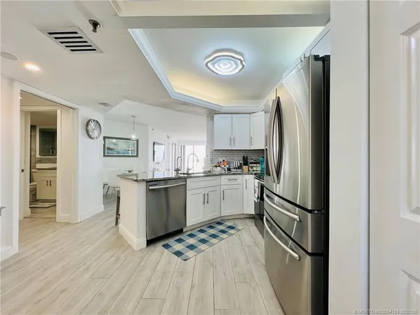 a view of a kitchen and dining room