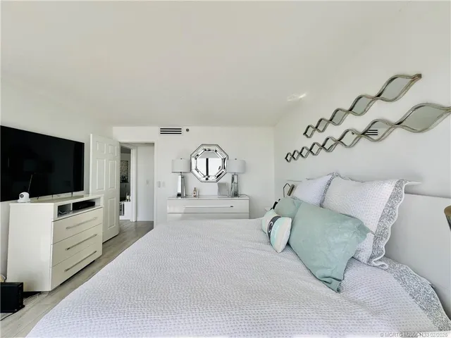 a bedroom with a bed and a television in it