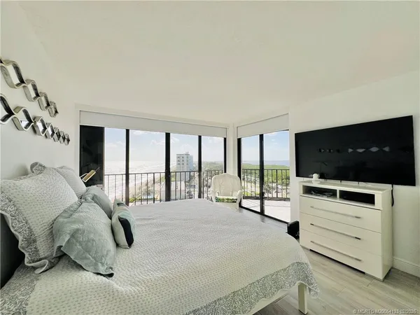 a bedroom that has a bed and a desk in it