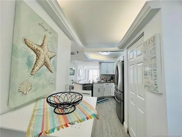 a kitchen with a refrigerator and a sink