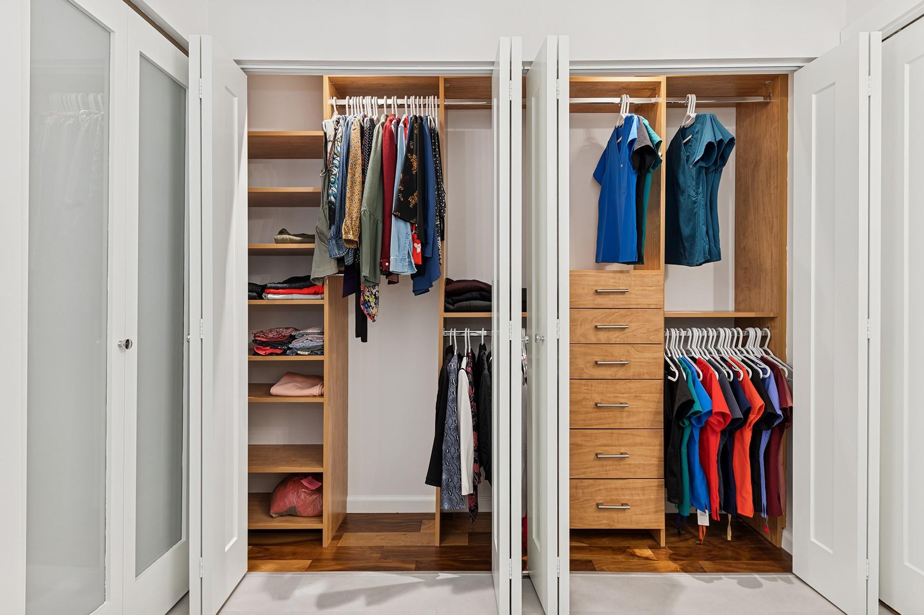 5560 Coach House Circle, Unit C Boca Raton, FL 33486 - Photo 14 of 19 a view of walk in closet with clothes