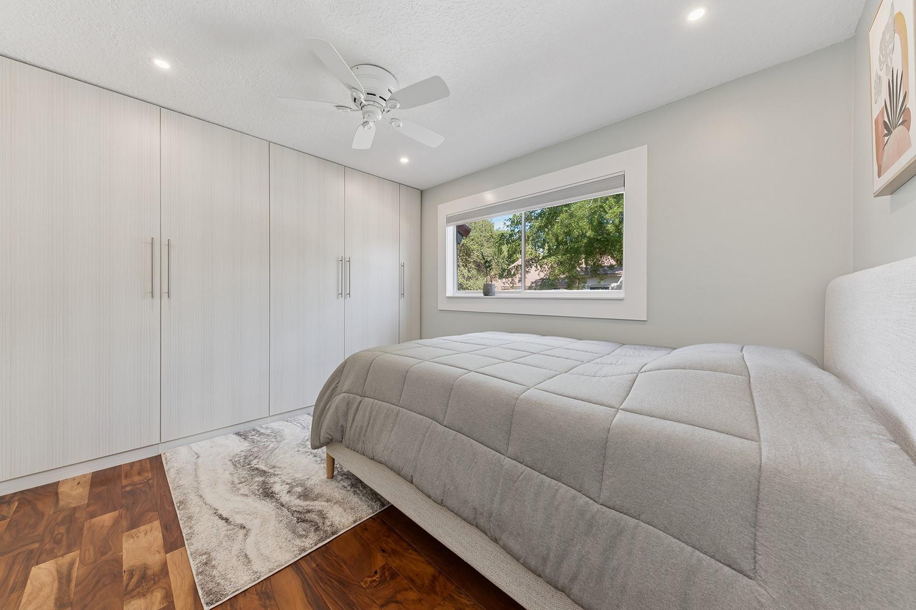 5560 Coach House Circle, Unit C Boca Raton, FL 33486 - Photo 15 of 19 a bedroom with a bed and a window