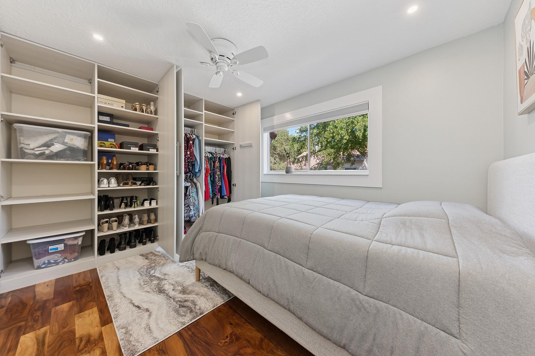 5560 Coach House Circle, Unit C Boca Raton, FL 33486 - Photo 16 of 19 a bedroom with a bed and a window