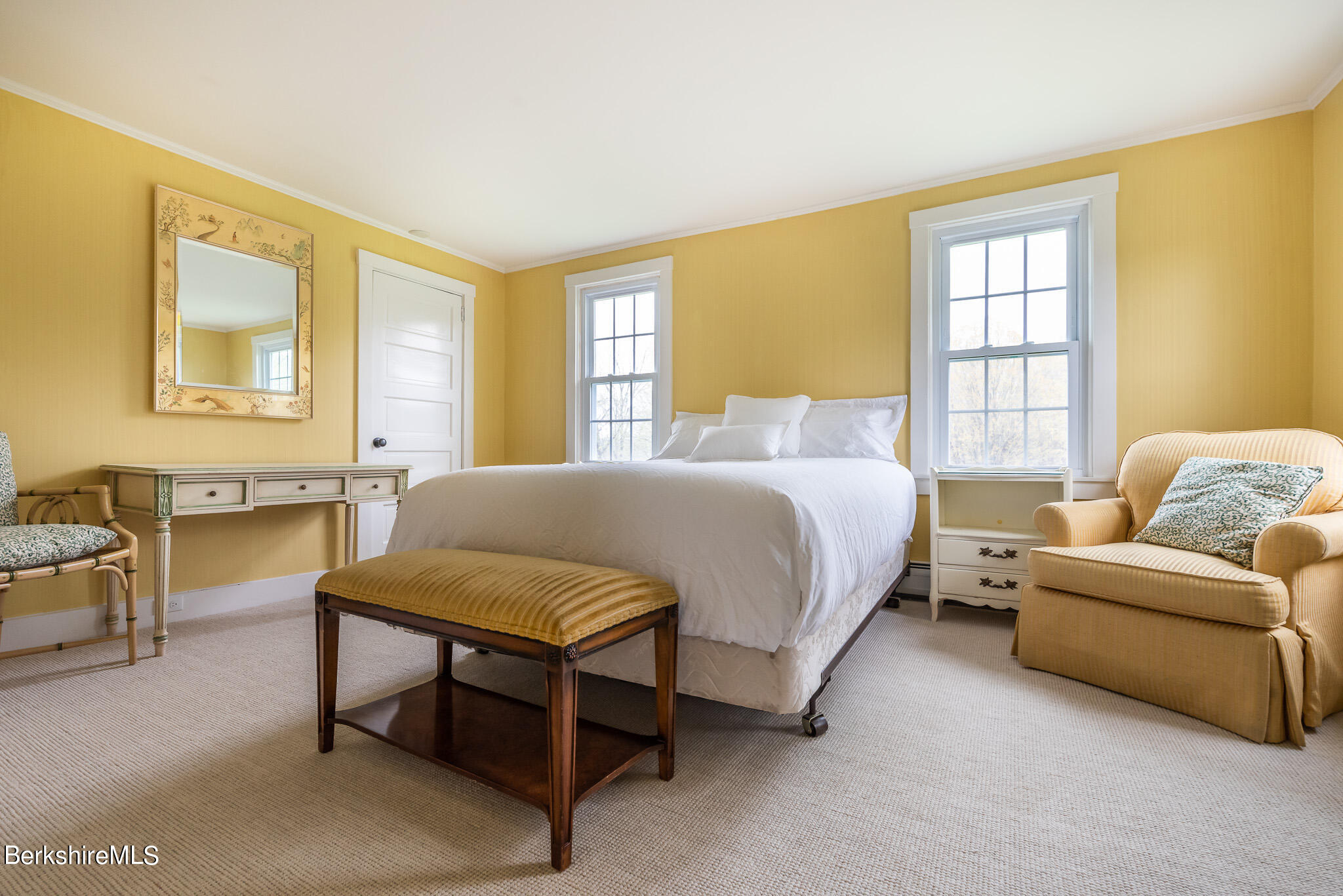 206 Blue Hill Road Great Barrington, MA 01230 - Photo 15 of 27 a spacious bedroom with a bed and a couch next to a window
