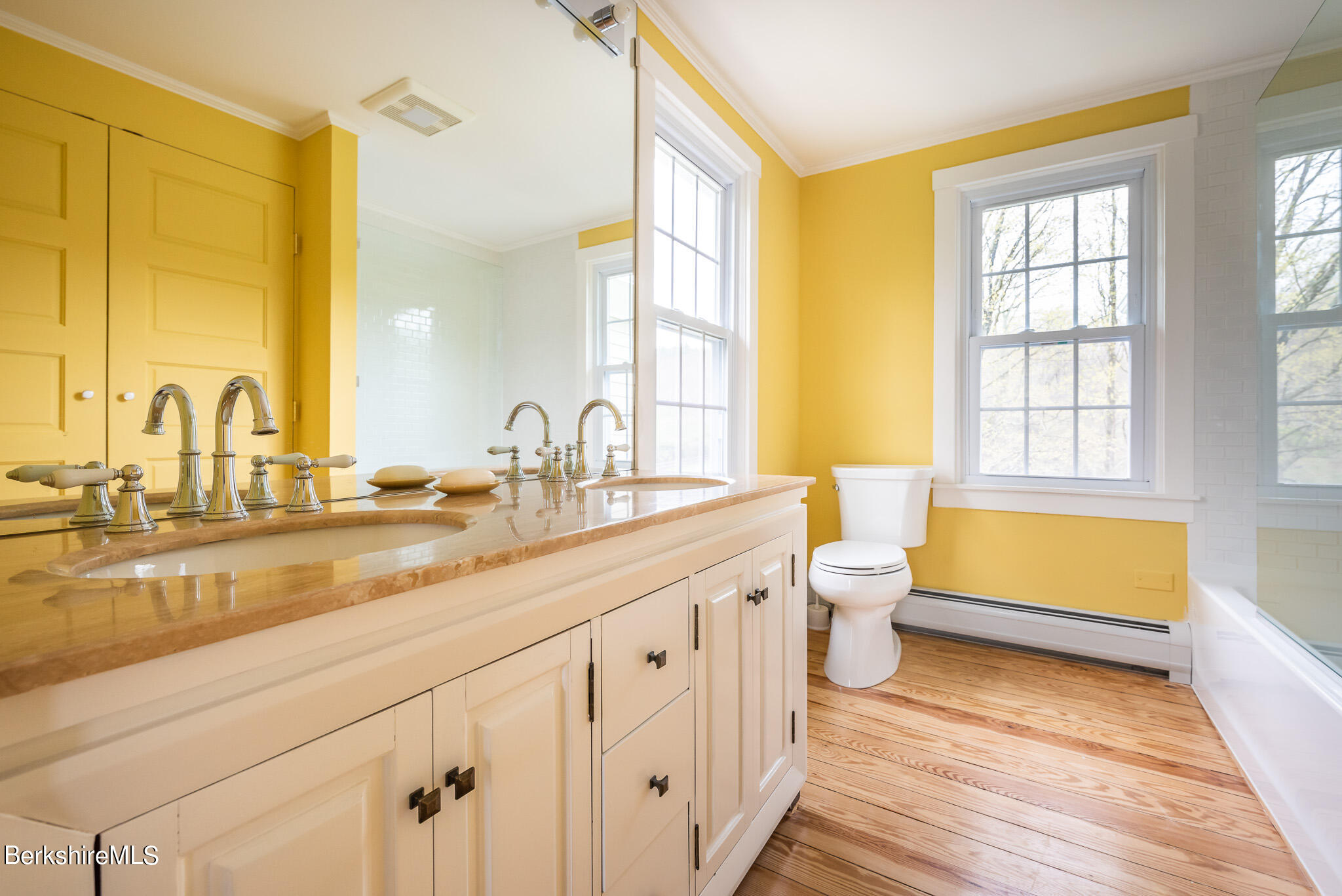 206 Blue Hill Road Great Barrington, MA 01230 - Photo 16 of 27 a bathroom with a double vanity sink a large mirror and a bathtub