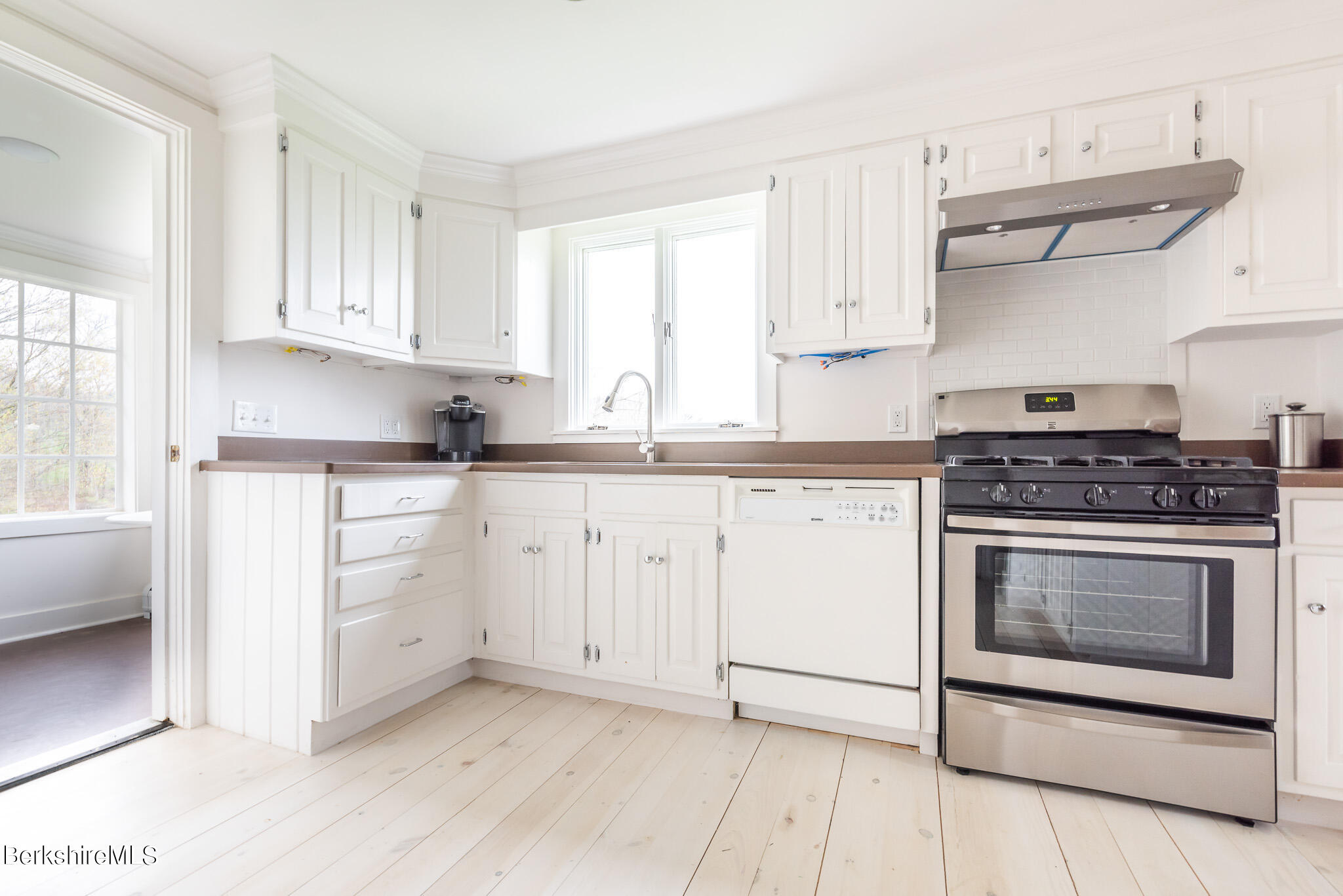 206 Blue Hill Road Great Barrington, MA 01230 - Photo 9 of 27 a kitchen with cabinets stainless steel appliances and a window