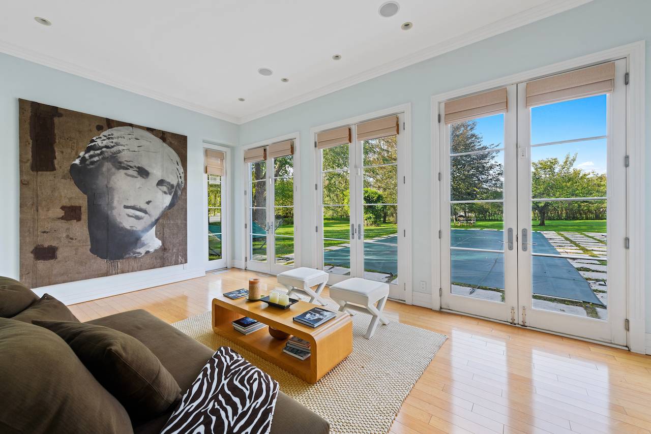 244 Flying Point Road Water Mill, NY 11976 - Photo 11 of 22 a living room with furniture and a large window