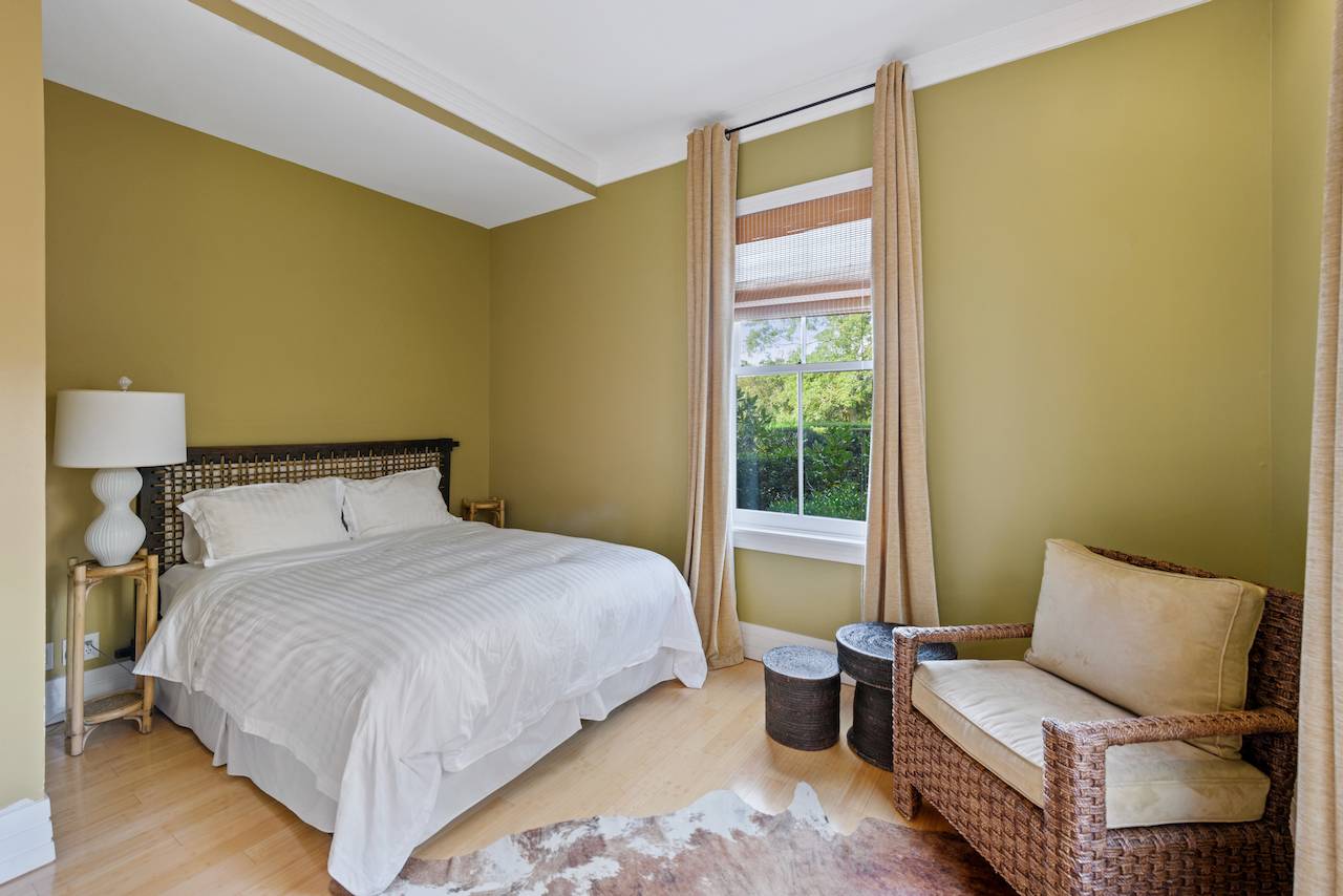 244 Flying Point Road Water Mill, NY 11976 - Photo 12 of 22 a bedroom with a bed couch and a window