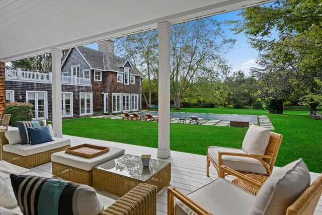 a view of a patio with a yard