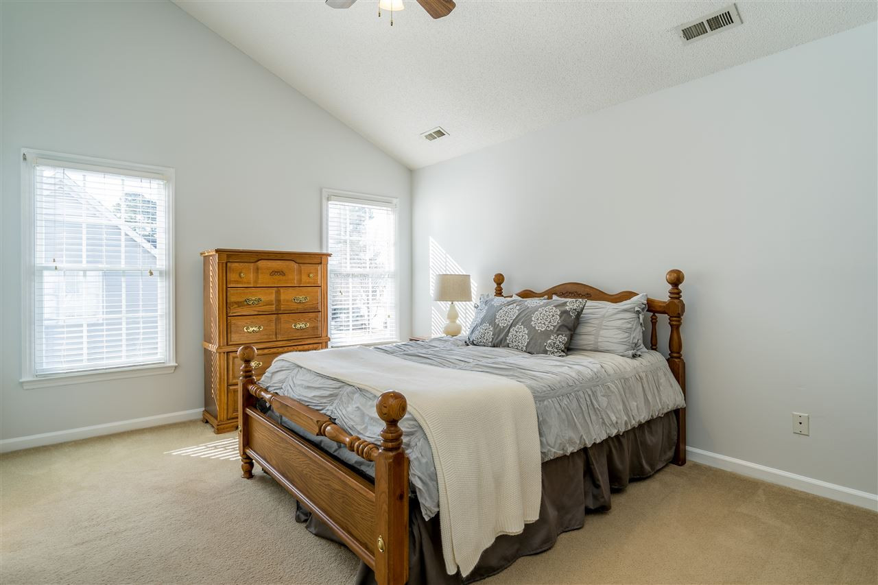 5221 Denmead Way Raleigh, NC 27613 - Photo 18 of 28 Light-filled owner's suite with vaulted ceilings and en suite bathroom and walk in closet! Owner's Suite
