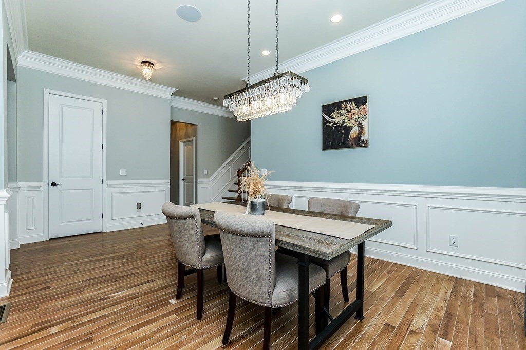 27 Pine Tree Drive, Unit 27 Methuen, MA 01844 - Photo 11 of 39 a view of a dining room with furniture and wooden floor