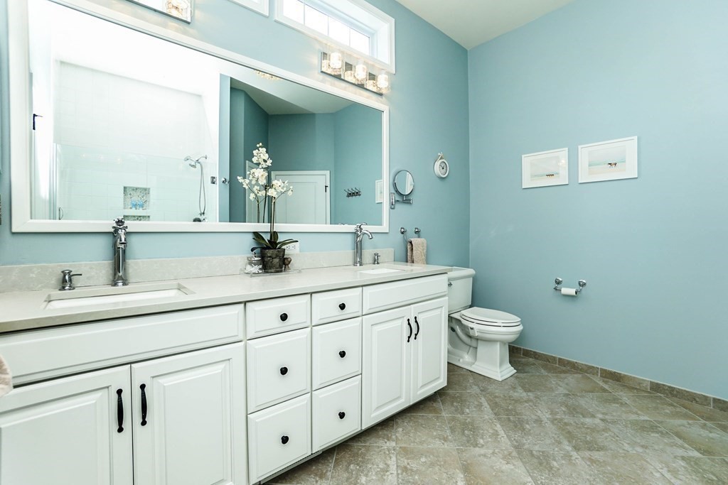 27 Pine Tree Drive, Unit 27 Methuen, MA 01844 - Photo 15 of 39 a bathroom with a toilet sink and mirror