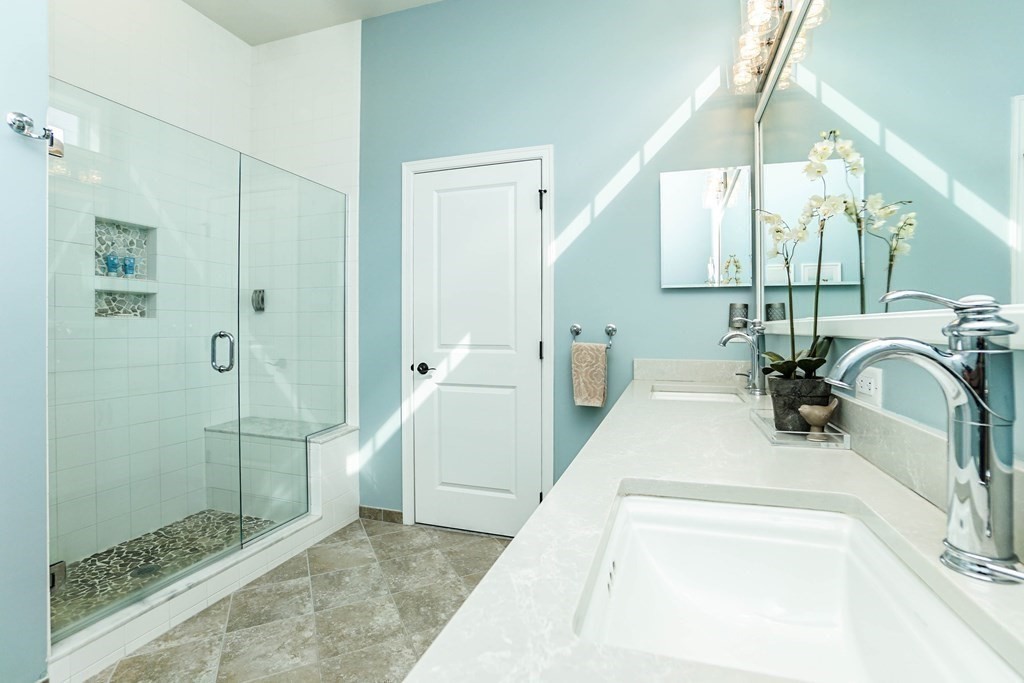 27 Pine Tree Drive, Unit 27 Methuen, MA 01844 - Photo 16 of 39 a bathroom with a sink a toilet and shower