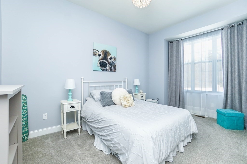 27 Pine Tree Drive, Unit 27 Methuen, MA 01844 - Photo 20 of 39 a bedroom with a bed and a window