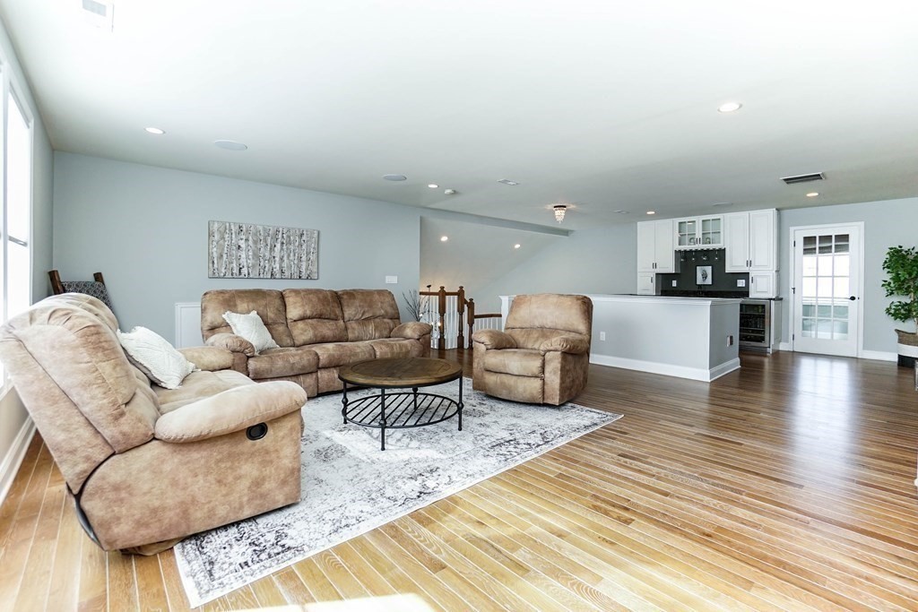 27 Pine Tree Drive, Unit 27 Methuen, MA 01844 - Photo 24 of 39 a living room with furniture and kitchen view