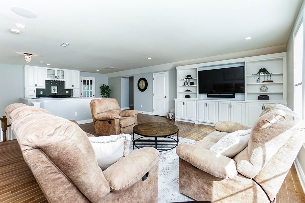 27 Pine Tree Drive, Unit 27 Methuen, MA 01844 - Photo 25 of 39 a living room with furniture and a flat screen tv