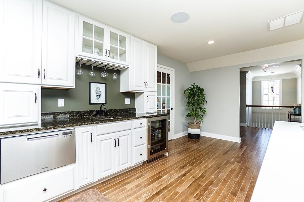 27 Pine Tree Drive, Unit 27 Methuen, MA 01844 - Photo 26 of 39 a kitchen with granite countertop a stove a sink and a refrigerator