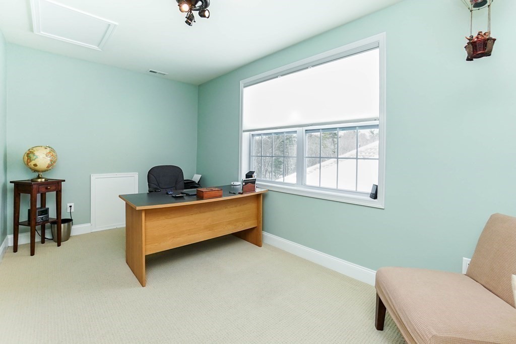 27 Pine Tree Drive, Unit 27 Methuen, MA 01844 - Photo 28 of 39 a room with furniture and a window