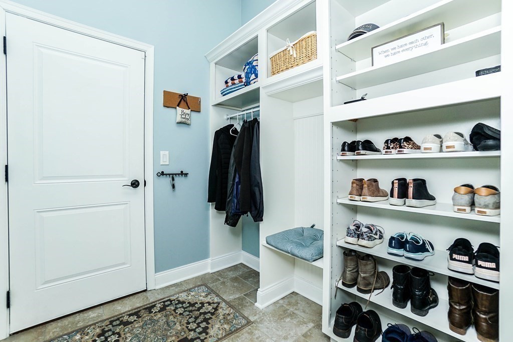 27 Pine Tree Drive, Unit 27 Methuen, MA 01844 - Photo 34 of 39 a view of walk in closet with clothes and shoes