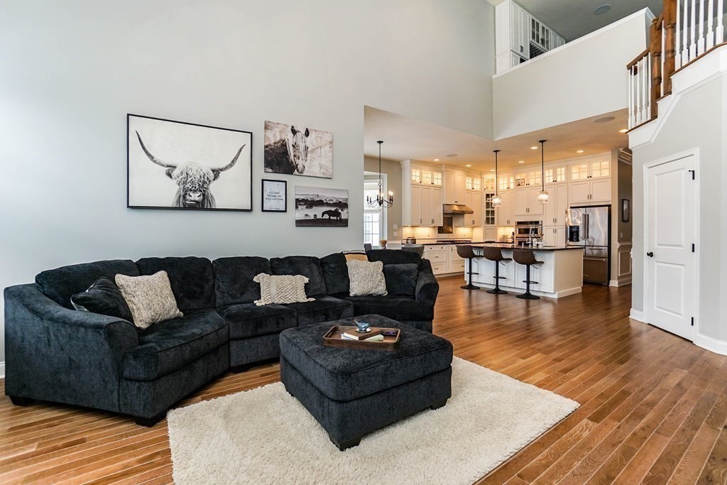 27 Pine Tree Drive, Unit 27 Methuen, MA 01844 - Photo 8 of 39 a living room with furniture kitchen view and a wooden floor