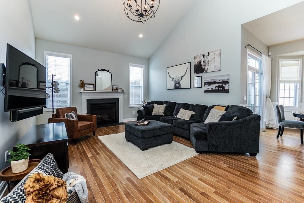 27 Pine Tree Drive, Unit 27 Methuen, MA 01844 - Photo 9 of 39 a living room with furniture fireplace and flat screen tv