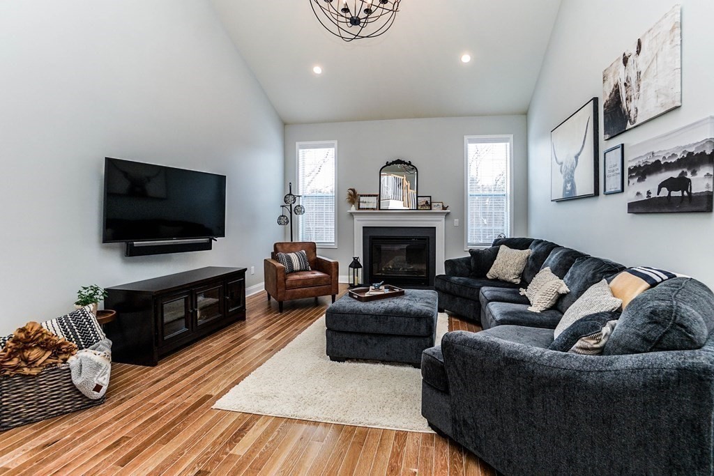 27 Pine Tree Drive, Unit 27 Methuen, MA 01844 - Photo 10 of 39 a living room with furniture and a flat screen tv