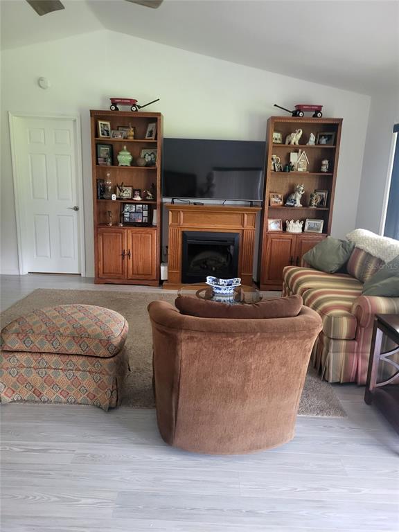 482 Pendleton Place Venice, FL 34292 - Photo 13 of 54 a living room with furniture and a fireplace
