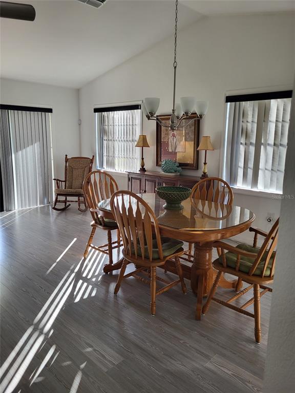 482 Pendleton Place Venice, FL 34292 - Photo 14 of 54 a view of a dining room with furniture window and wooden floor
