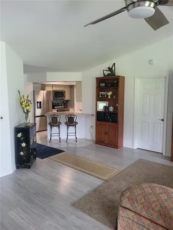 a bedroom with a bed and a tv