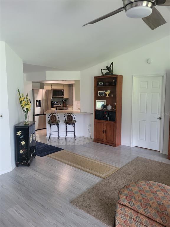 482 Pendleton Place Venice, FL 34292 - Photo 15 of 54 a living room with furniture and wooden floor
