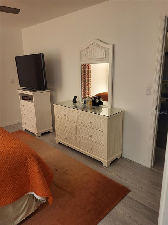 482 Pendleton Place Venice, FL 34292 - Photo 18 of 54 a room with a bed and a television