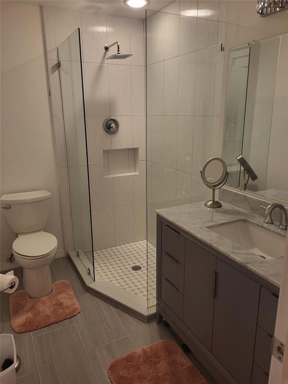 482 Pendleton Place Venice, FL 34292 - Photo 19 of 54 a bathroom with a toilet sink and shower