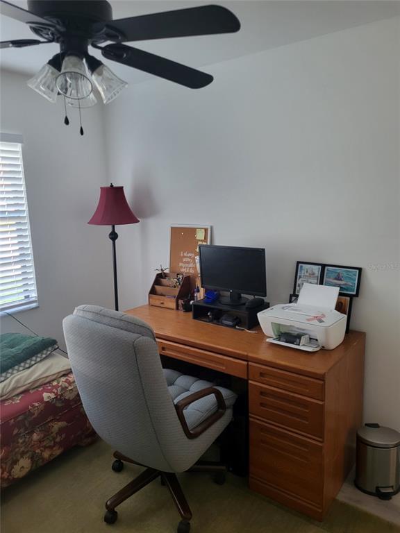 482 Pendleton Place Venice, FL 34292 - Photo 21 of 54 a work room with furniture and a lamp