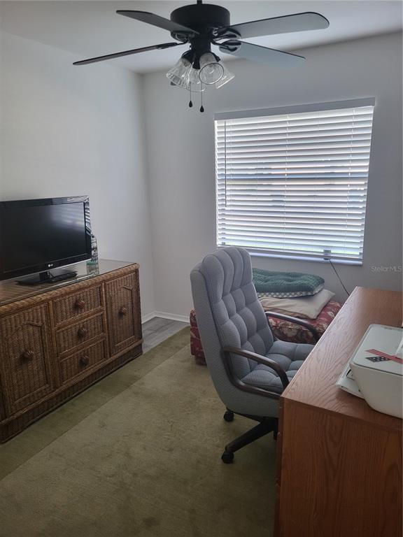 482 Pendleton Place Venice, FL 34292 - Photo 22 of 54 a view of a workspace with furniture and a window