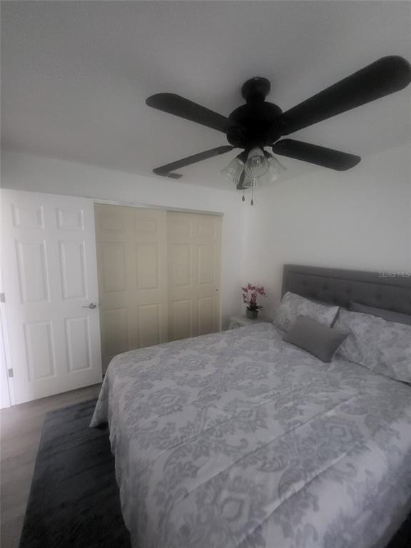 482 Pendleton Place Venice, FL 34292 - Photo 26 of 54 a bedroom with a bed and a chandelier