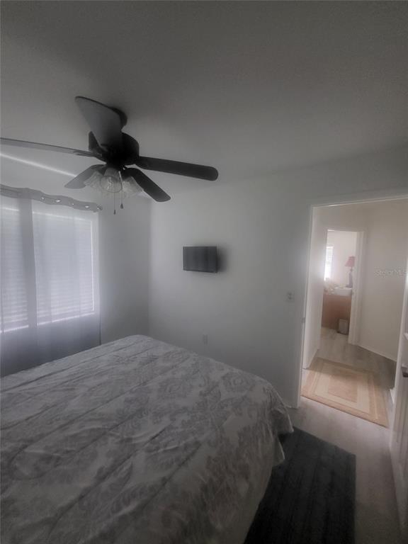 482 Pendleton Place Venice, FL 34292 - Photo 27 of 54 a bedroom with a bed and a painting on the wall