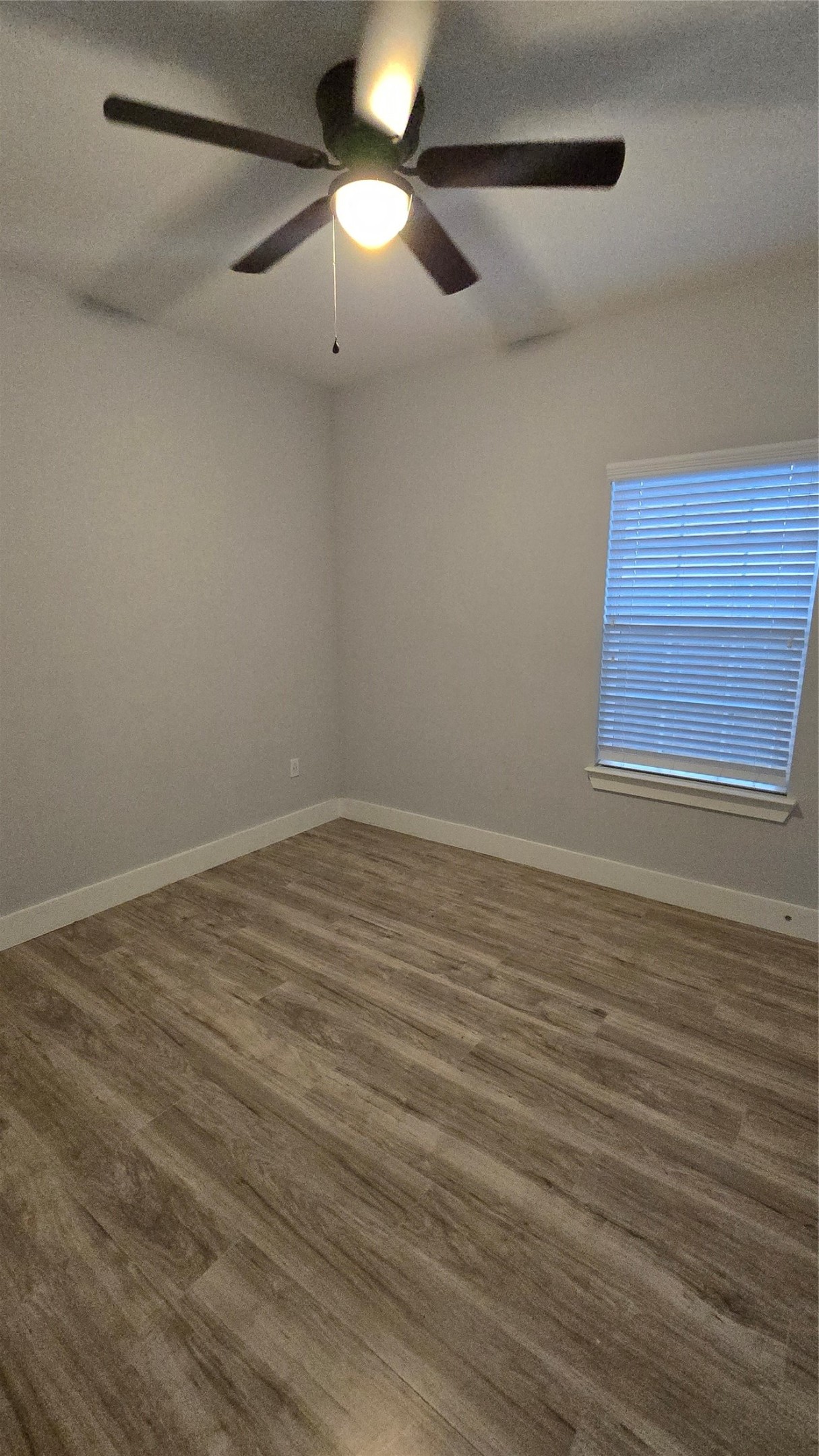 10017 Morocco Road Houston, TX 77041 - Photo 11 of 24 wooden floor in an empty room