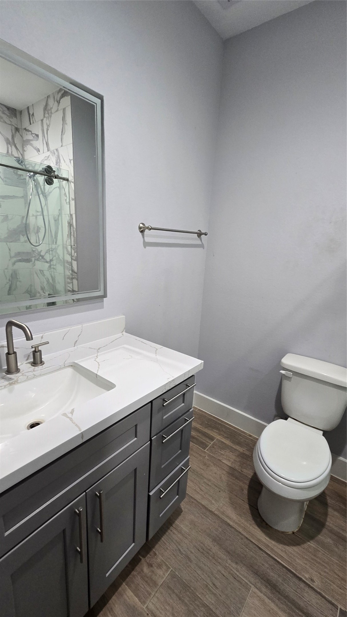 10017 Morocco Road Houston, TX 77041 - Photo 12 of 24 a bathroom with a granite countertop toilet sink and mirror