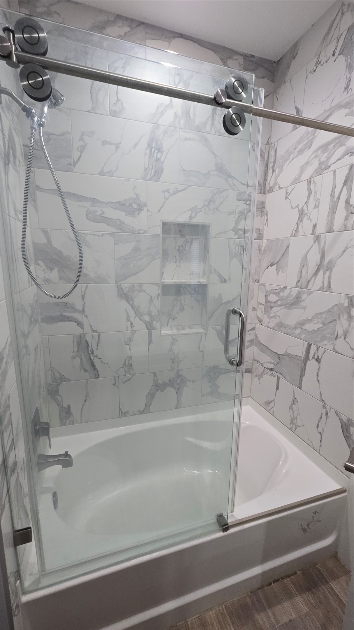 10017 Morocco Road Houston, TX 77041 - Photo 13 of 24 a bathroom with a shower and a bathtub