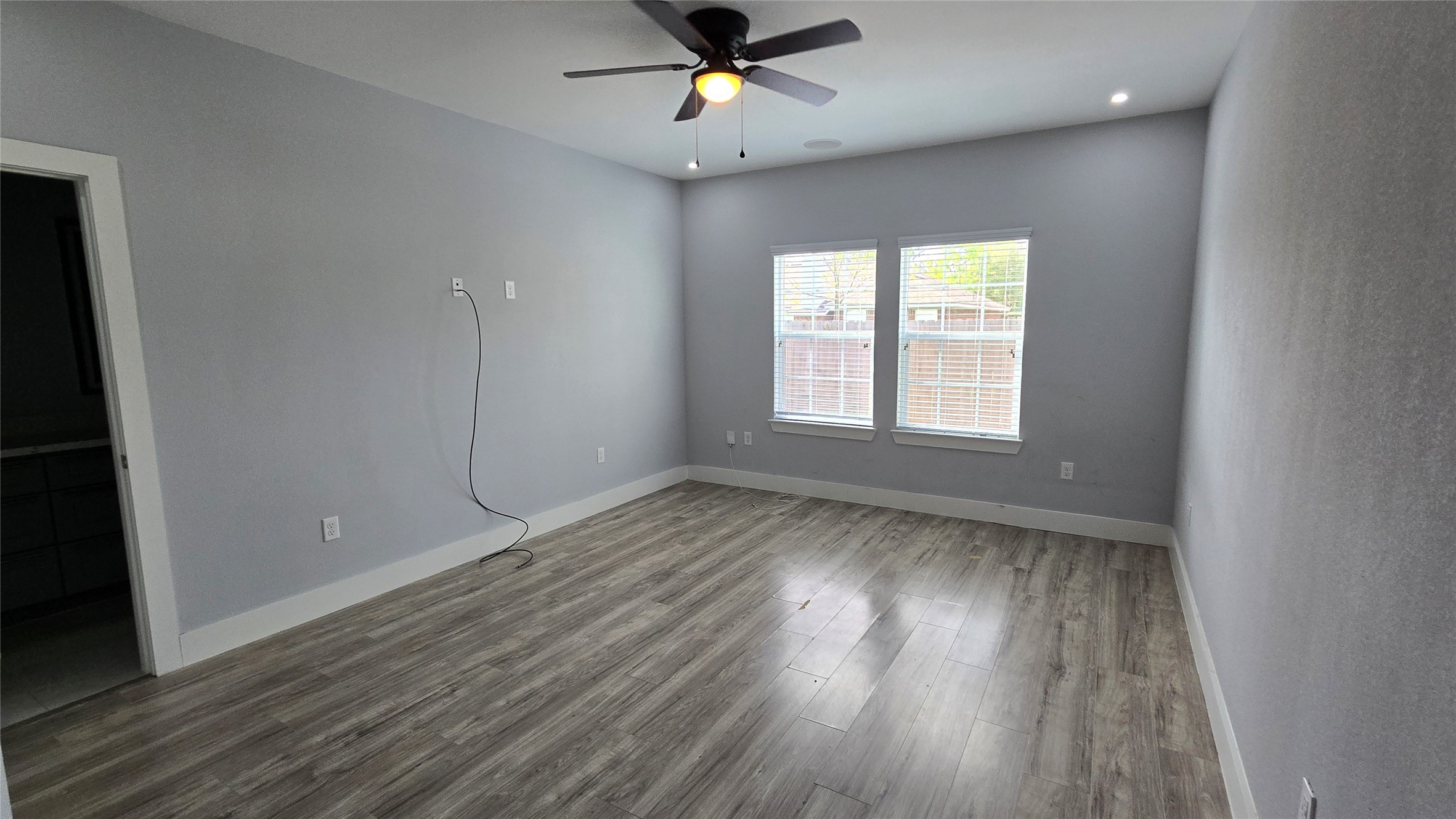 10017 Morocco Road Houston, TX 77041 - Photo 15 of 24 wooden floor in an empty room with a window