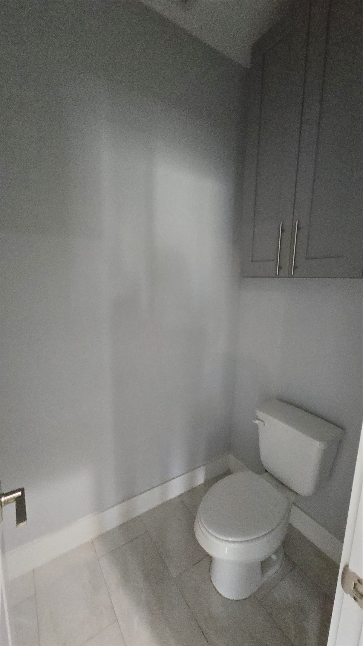 10017 Morocco Road Houston, TX 77041 - Photo 20 of 24 a white toilet sitting next to a shower