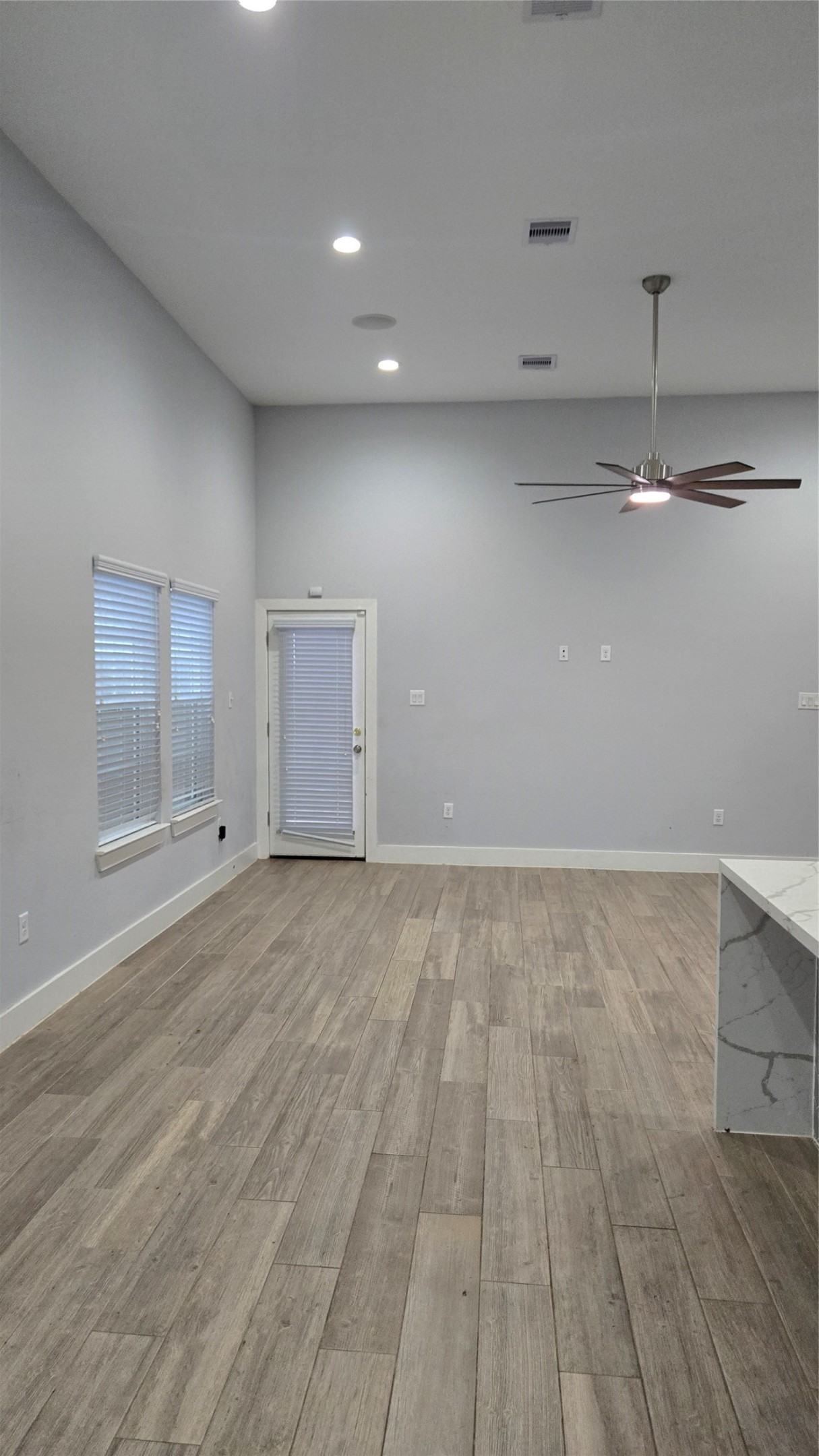10017 Morocco Road Houston, TX 77041 - Photo 3 of 24 a view of a room with wooden floor and window