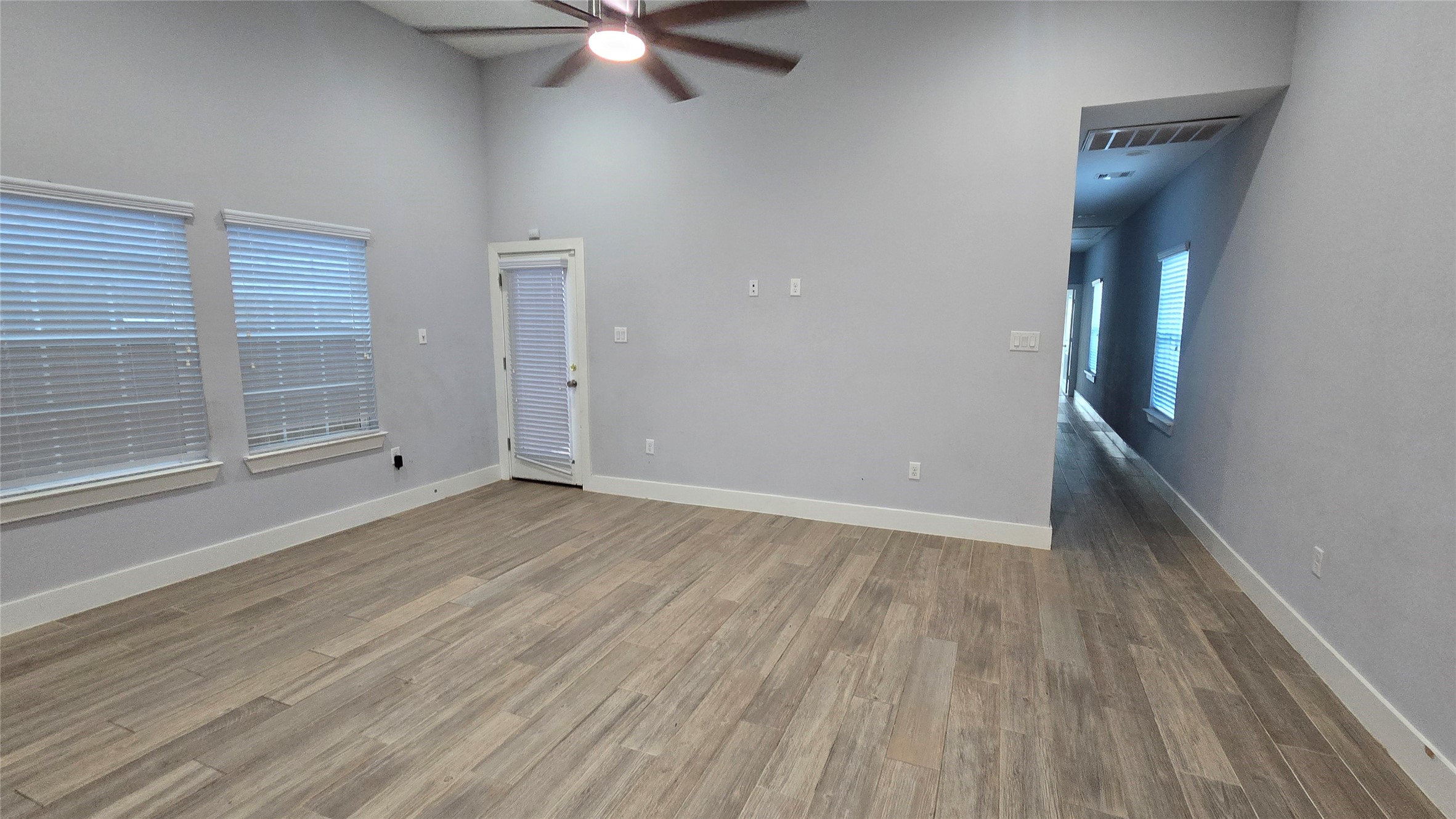 10017 Morocco Road Houston, TX 77041 - Photo 6 of 24 wooden floor in an empty room with a window
