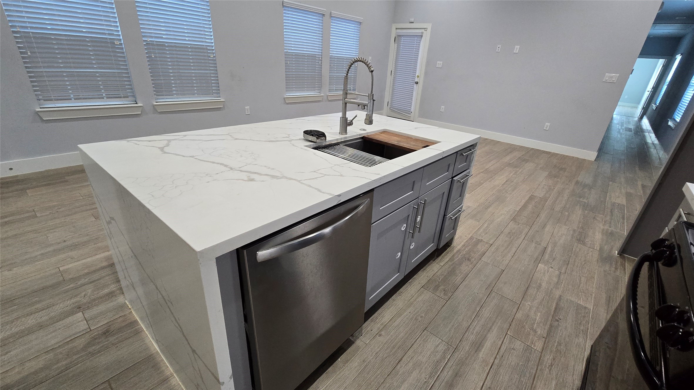 10017 Morocco Road Houston, TX 77041 - Photo 10 of 24 a kitchen with a sink and wooden floor