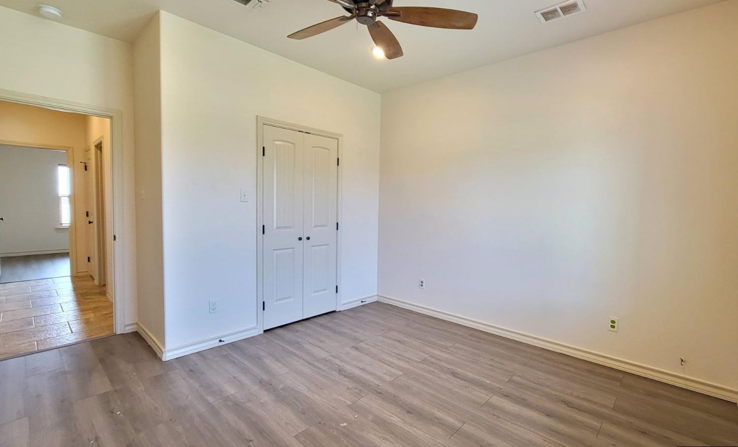 5234 Kemper Street Lubbock, TX 79416 - Photo 28 of 28 wooden floor in an empty room