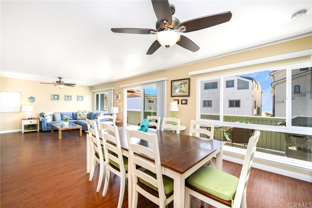 5100 Seashore Drive Newport Beach, CA 92663 - Photo 12 of 67 a dining room with furniture window and wooden floor