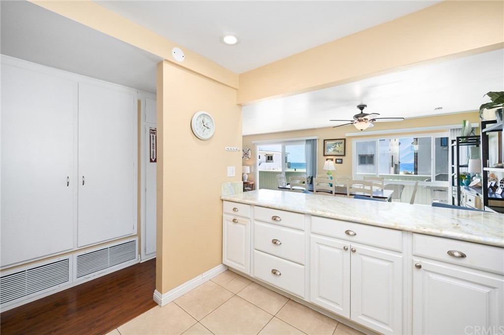 5100 Seashore Drive Newport Beach, CA 92663 - Photo 20 of 67 a bathroom with a granite countertop sink and a mirror